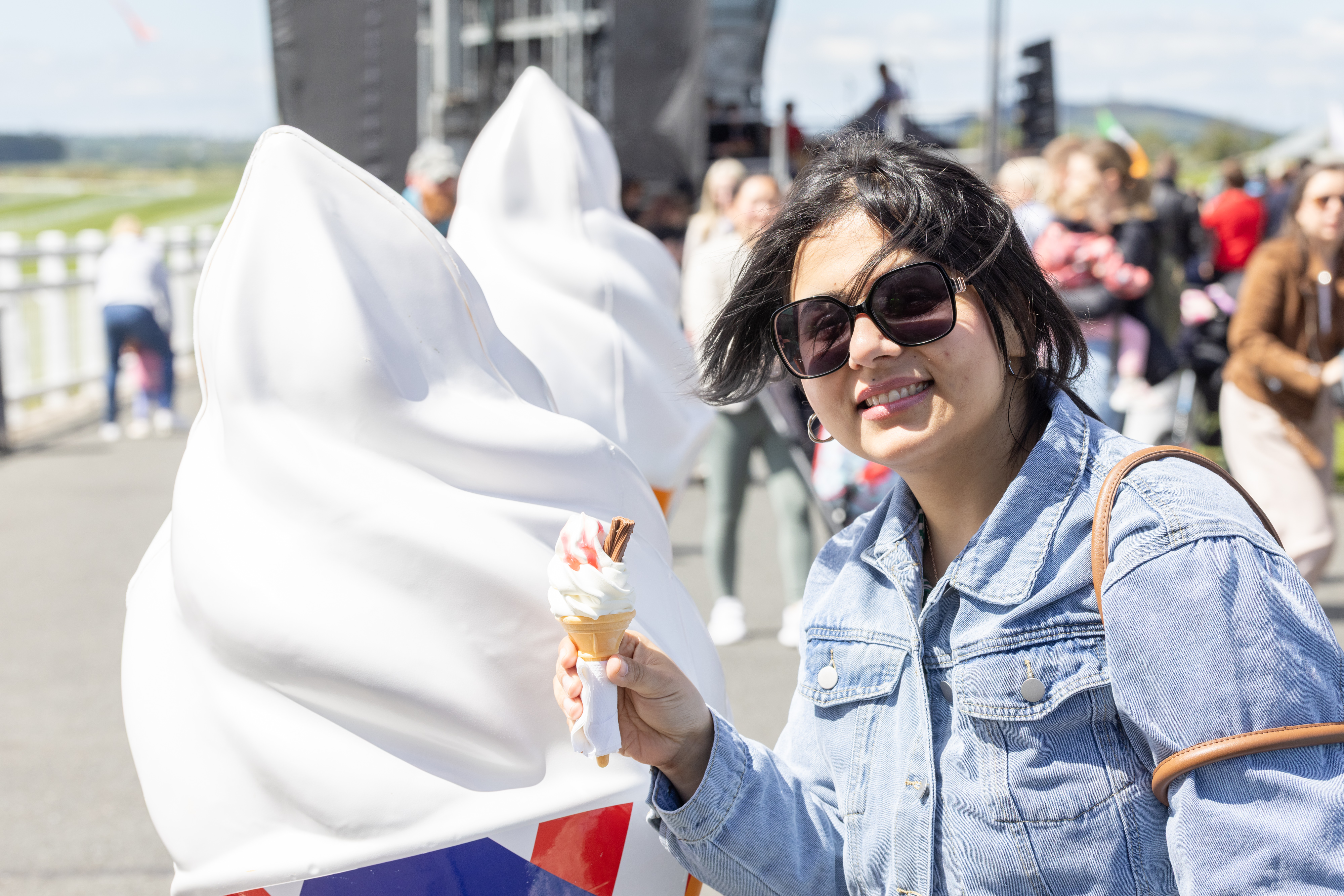 Person smiling with ice-cream.